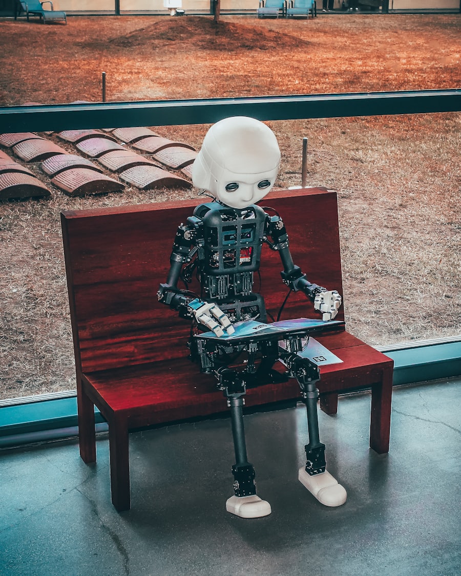A humanoid robot sitting on a bench, reading