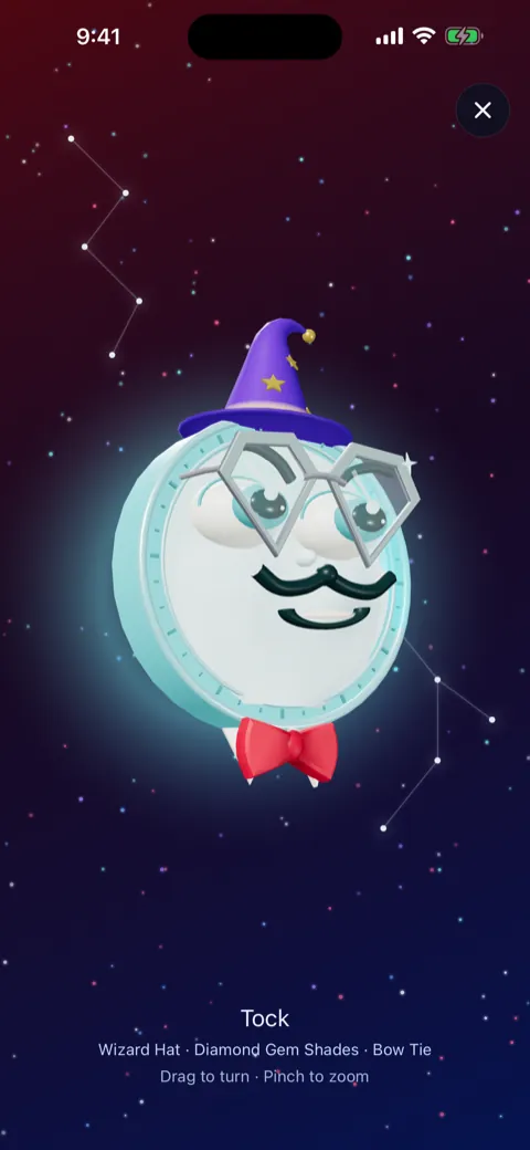 Tock full screen in 3D among the stars, wearing a wizard hat, Diamond Gem Shades and a bow tie, with drag to turn and pinch to zoom hints